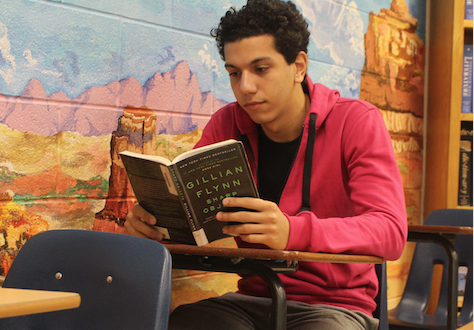 Osama reads to inspire himself for his stories. Photo by Alex Rush