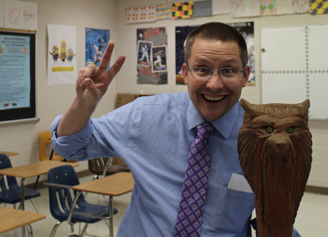 Sophomore Class Sponsor Scott Fleshman Poses Next To The Spirit Stick. Photo by Adam Webster