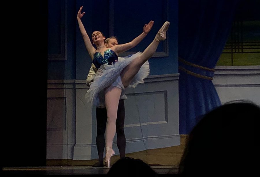 Elizabeth Grist performs on stage as Cinderella with in instructor Devin Sweet