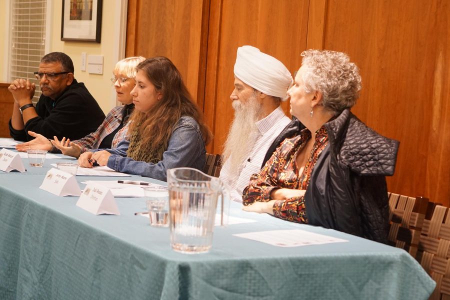 Interfaith+Panel+members+listen+to+a+question+from+an+audience+member.