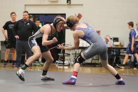 A Wildcat wrestler prepares to compete in a match.