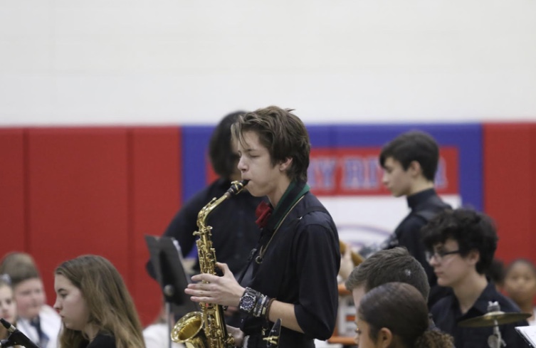 Senior Colby Ervin plays the saxophone in the jazz band concert.