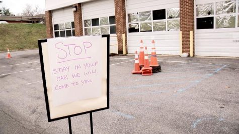 A sign outside the Food Pantry instructs visitors to stay in their cars. Photo provided by WDBJ7.