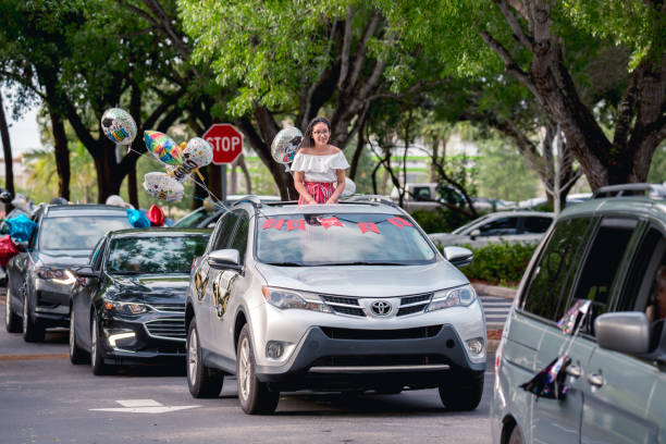 Coral Springs, Florida, USA - May 29, 2020: South Florida Graduation Car Parade 2020 during COVID-19 coronavirus quarantine. Florida students celebrating Graduation 2020 at Coral Springs.