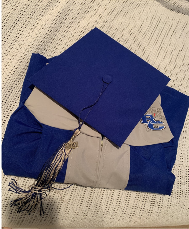 RCHS Seniors pick up cap and gowns on Wednesday, April 14 ahead of the graduation ceremony.