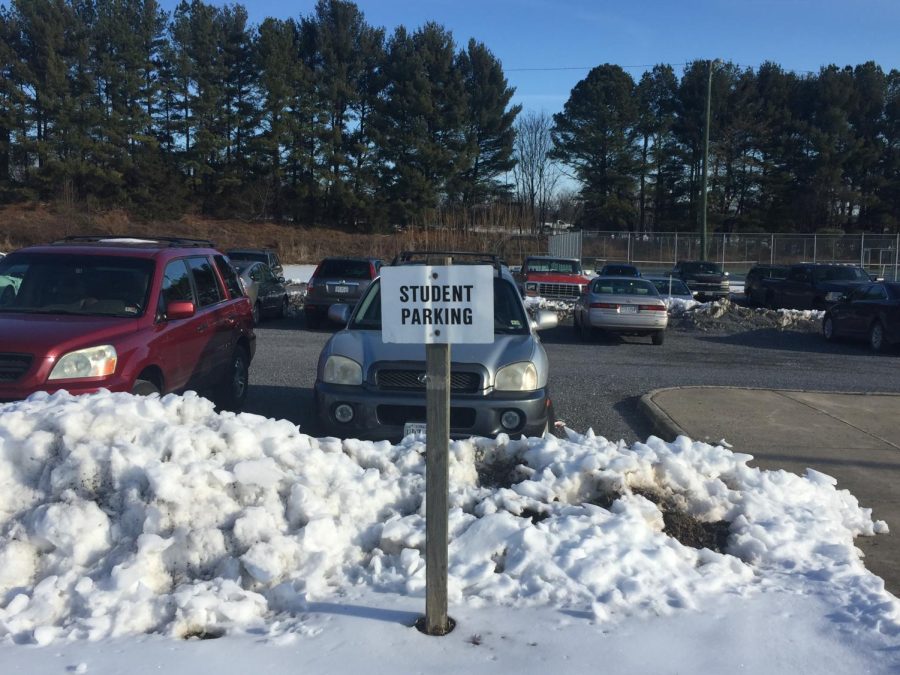 Drivers are greeted by a sign that says “Student Parking” as they enter the junior parking lot. 
