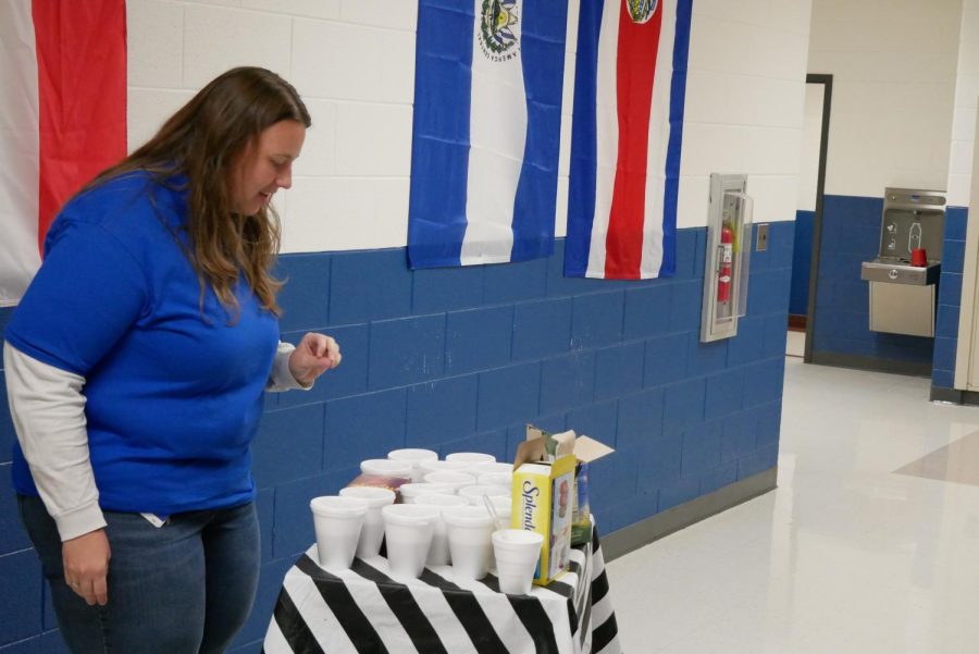 Mrs. Jamie Youngblood selects coffee from the cart.