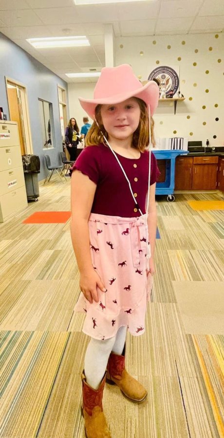 First grader, Sophia White shows school spirit dressed up in her cowboy clothes for Cowboys vs Aliens!
