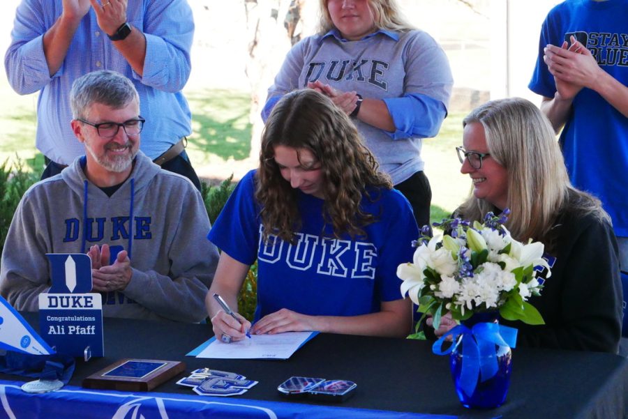 Alison Pfaff signs her commitment to swim at Duke University in the 2023 school year. Photo taken by Maxwell Pearson.