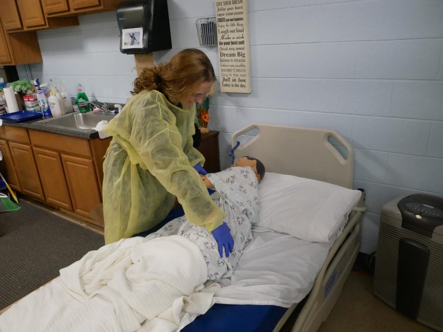Sarah Allen dresses a dummy patient in her Nurse Aide Class.
Photo taken by Maxwell Pearson

