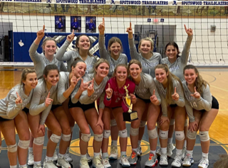 The team celebrates with the district trophy. Photo taken by Stephanie Blevins.