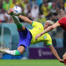 Brazilian striker Richarilson goes airborne to net his second goal against Serbia.
Brazils Richarlison scores their second goal, by Amanda Perobelli from Reuters.