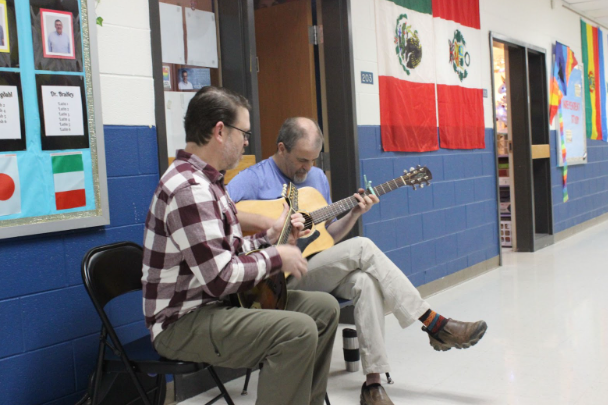Mr. McGrath and Dr. Youngdahl playing music in the halls on a Thursday morning 
