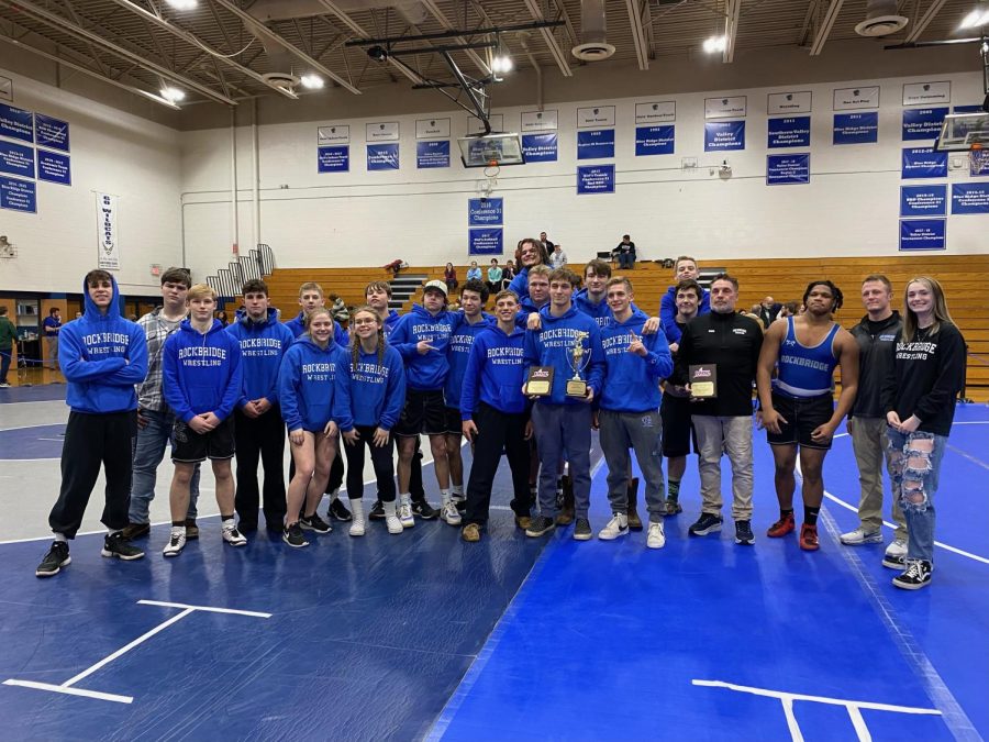 The wrestling team takes a team photo to celebrate being the 2023 Valley District Champions and to celebrate Coach Wood and senior Brice Hall’s achievements.
