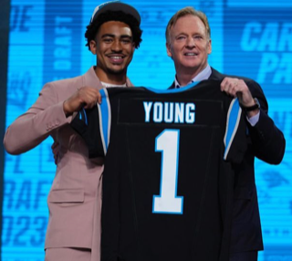 Bryce Young holds up his jersey after being selected with the first pick.
Photo courtesy of Carolina Panthers.