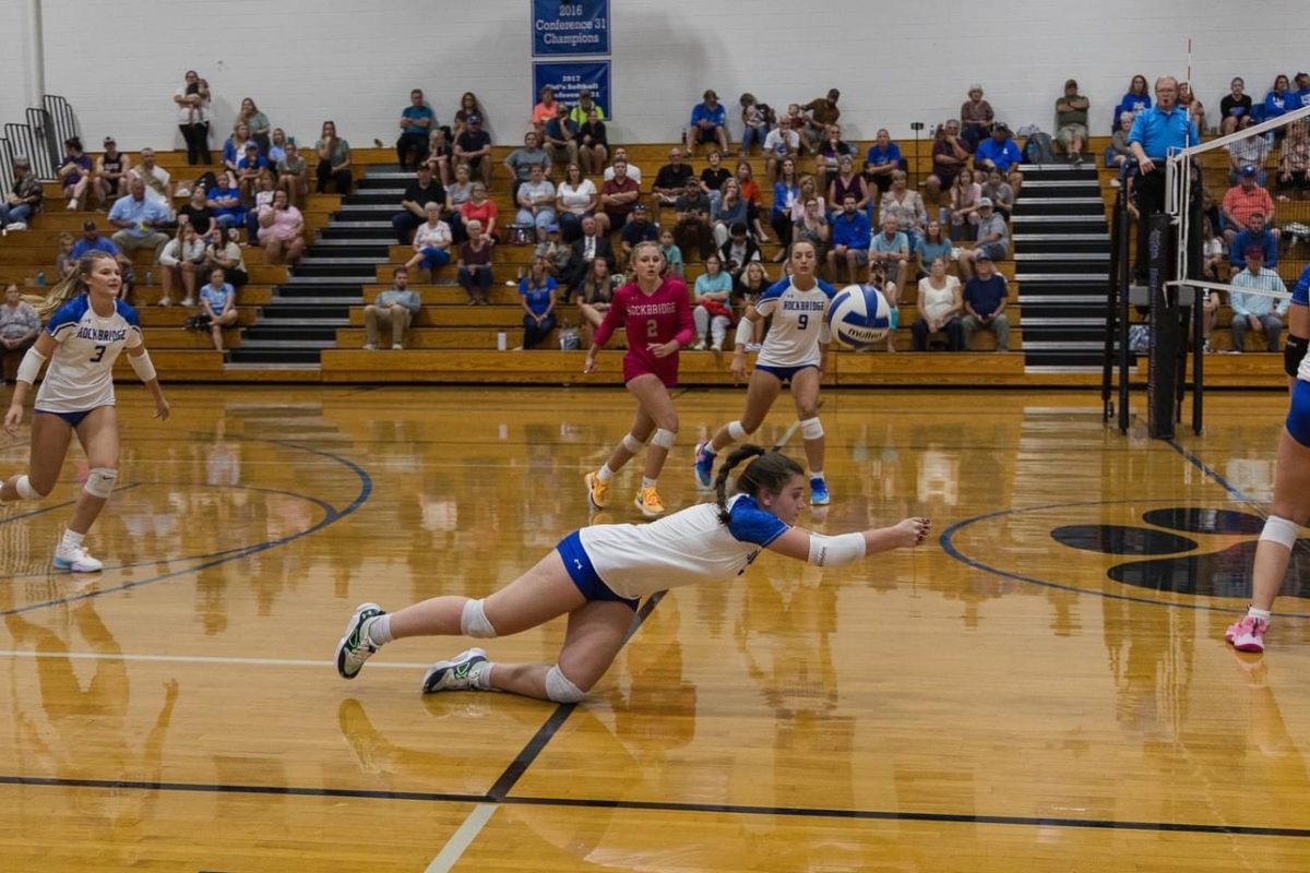 Rebecca Allen digs an attack from Fort Defiance. Photo by Brandi Wimer. 
