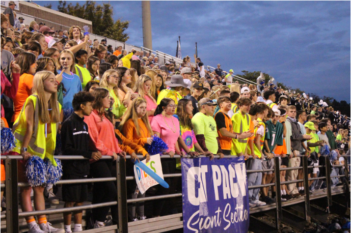 Students show their school spirit in the Cat Pack Section at the Homecoming Football Game.