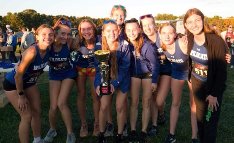 “Cross Country Girls with Trophy” by Rockbridge County High School Athletics licensed under https://www.instagram.com/rockbridgeathletics/
