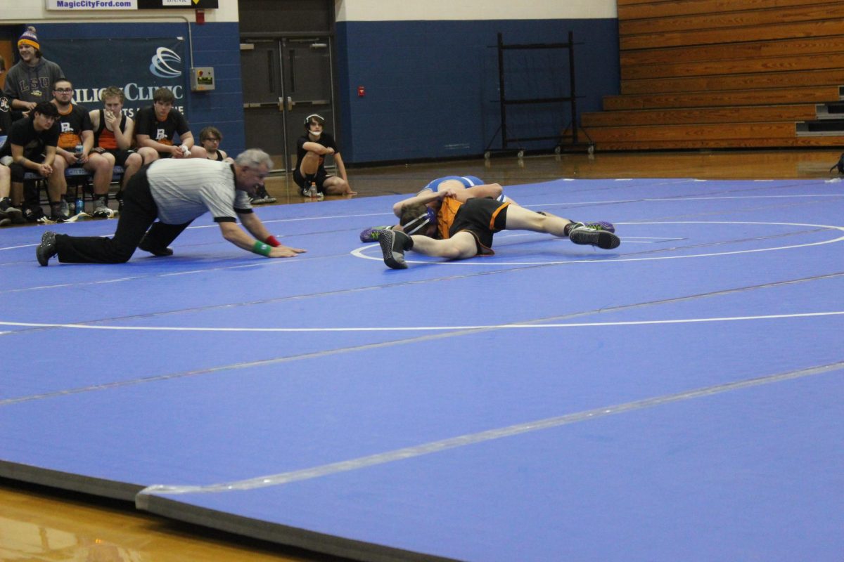 Hudson Ryan attempts to pin a wrestler from Bath County