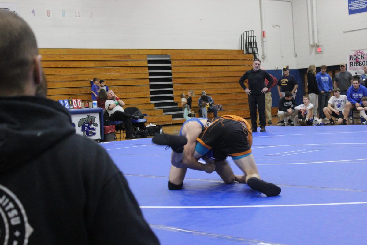Caiden Covasos takes down a wrestler from Bath County