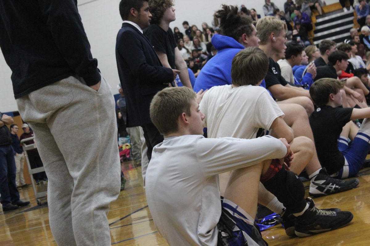 RCHS wrestlers watch their teammate, Caiden Covasos, compete 