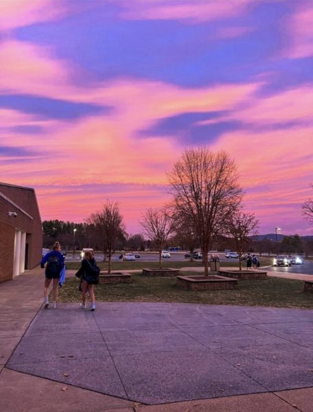 Students walk to their cars after practicing under a Rockbridge County sunset. Photo taken by Emily Humphreys. 
