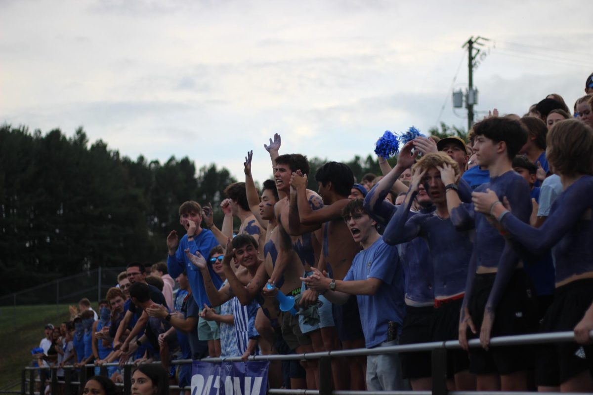 Students cheer on the football team during the August game against PM.