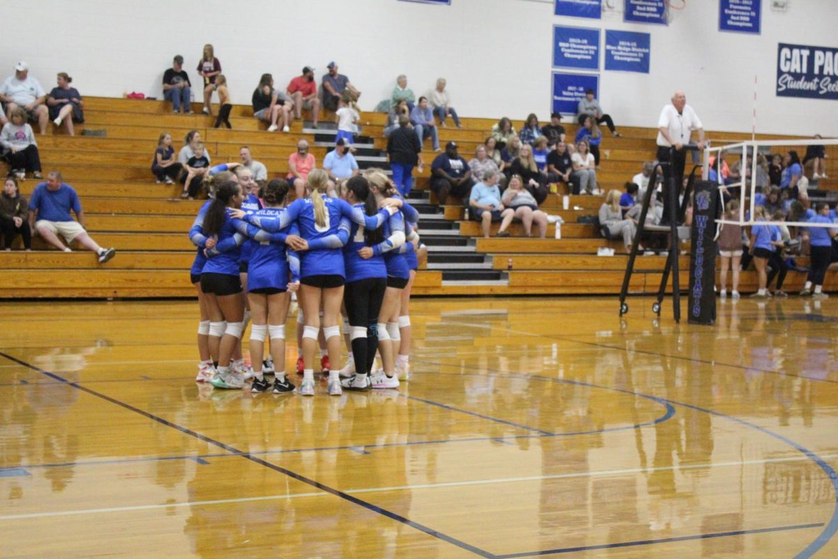 The JV team huddles before the game.