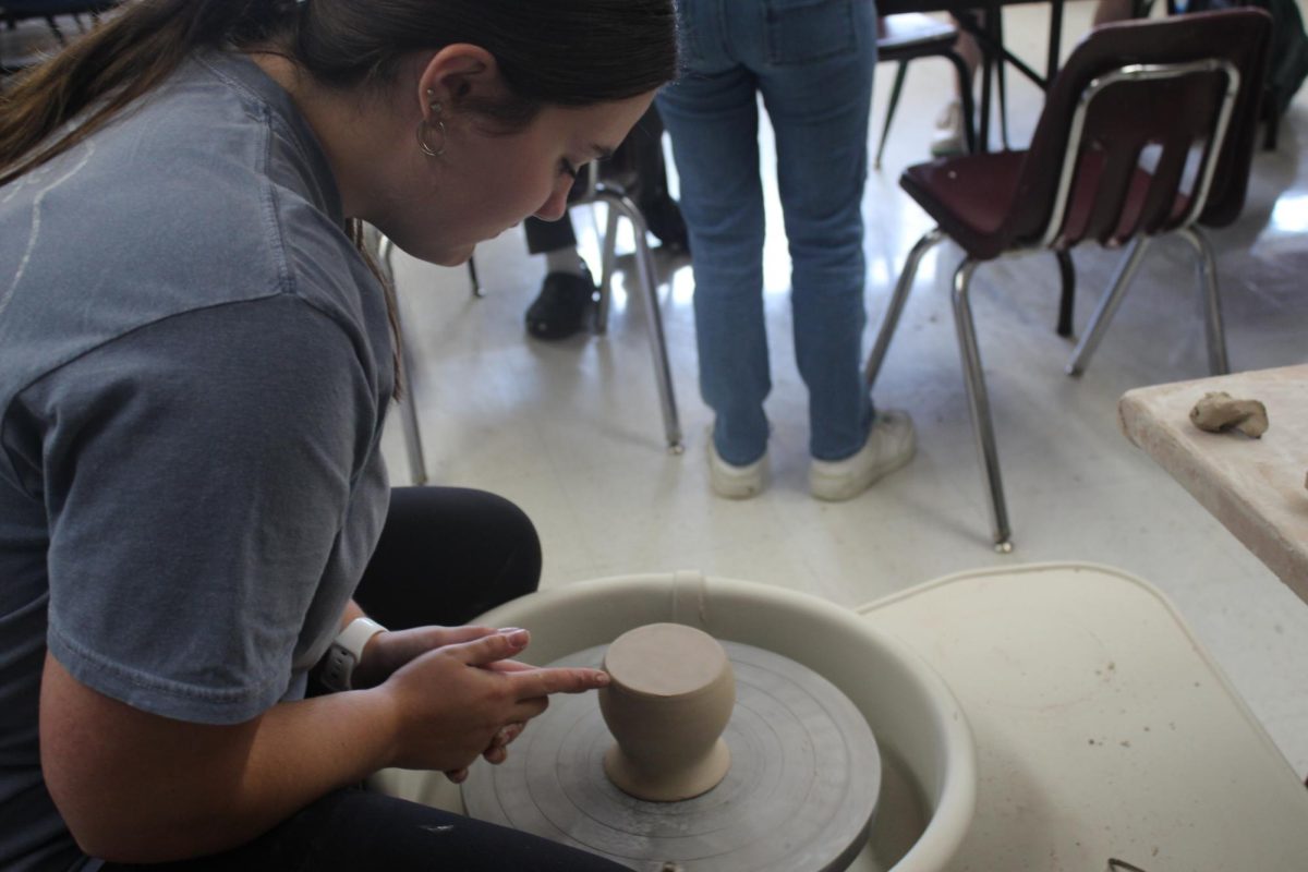 Senior Morgan Martin uses the pottery wheel.