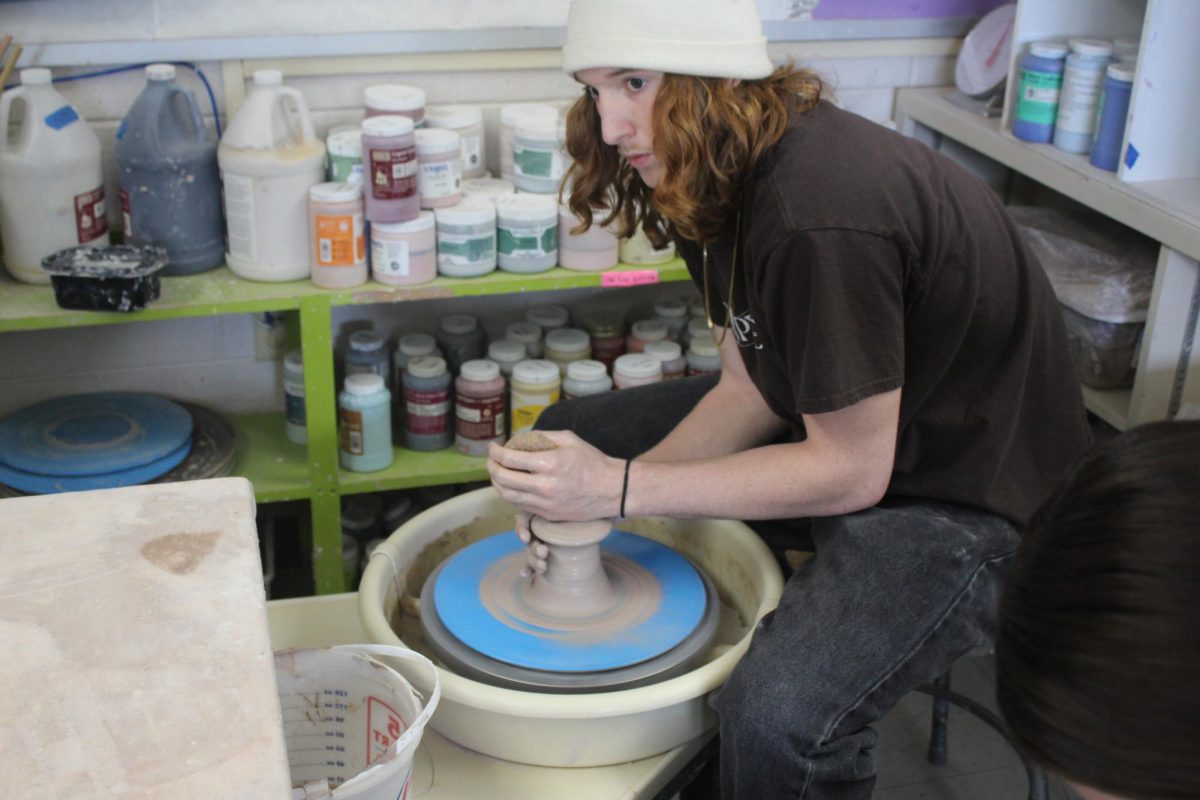 Junior Jamie Ingram uses the pottery wheel. 