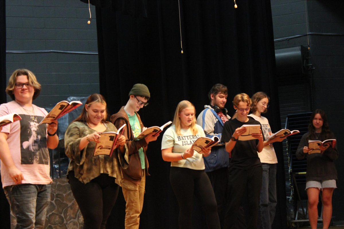 Sophomore Joshua Hughes, junior Sierra Hostetter, junior Tommy Davis, freshman Abigail Woodford, and sophomore Kellan Foster rehearse a scene. 