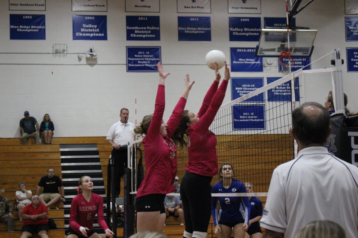 Sophomore Emma Johnson and  Junior Mackenzie McCormick and block attack 