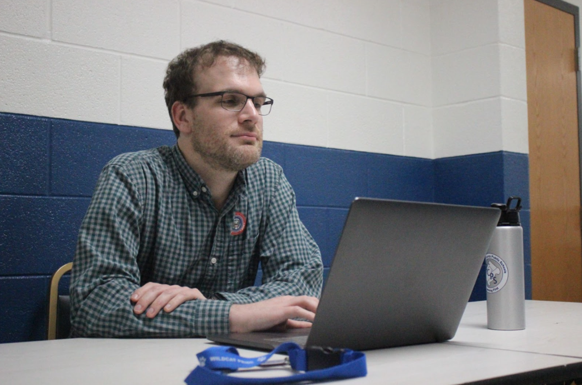 Chris Gallagher checks a student into the bathroom.