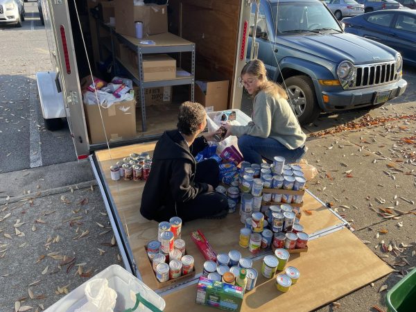 Elsa Kerin-Rice and Sarah Brown sort the food gathered from the drive.