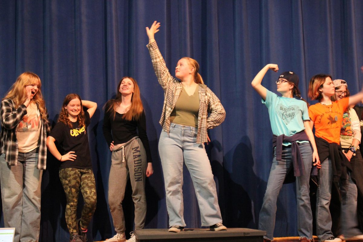 Abigail Woodford (middle) and ensemble striking a pose at the end of ‘So Much Better’.