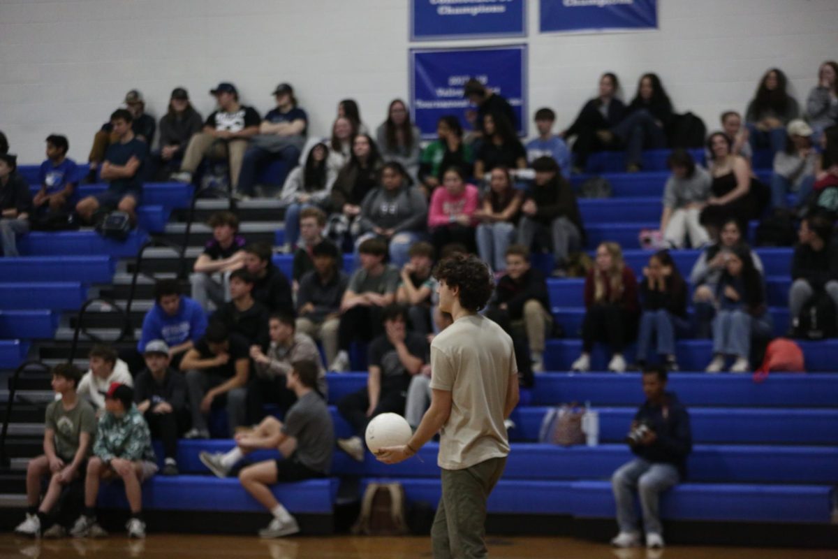 Senior Quincy Speers serves the ball.