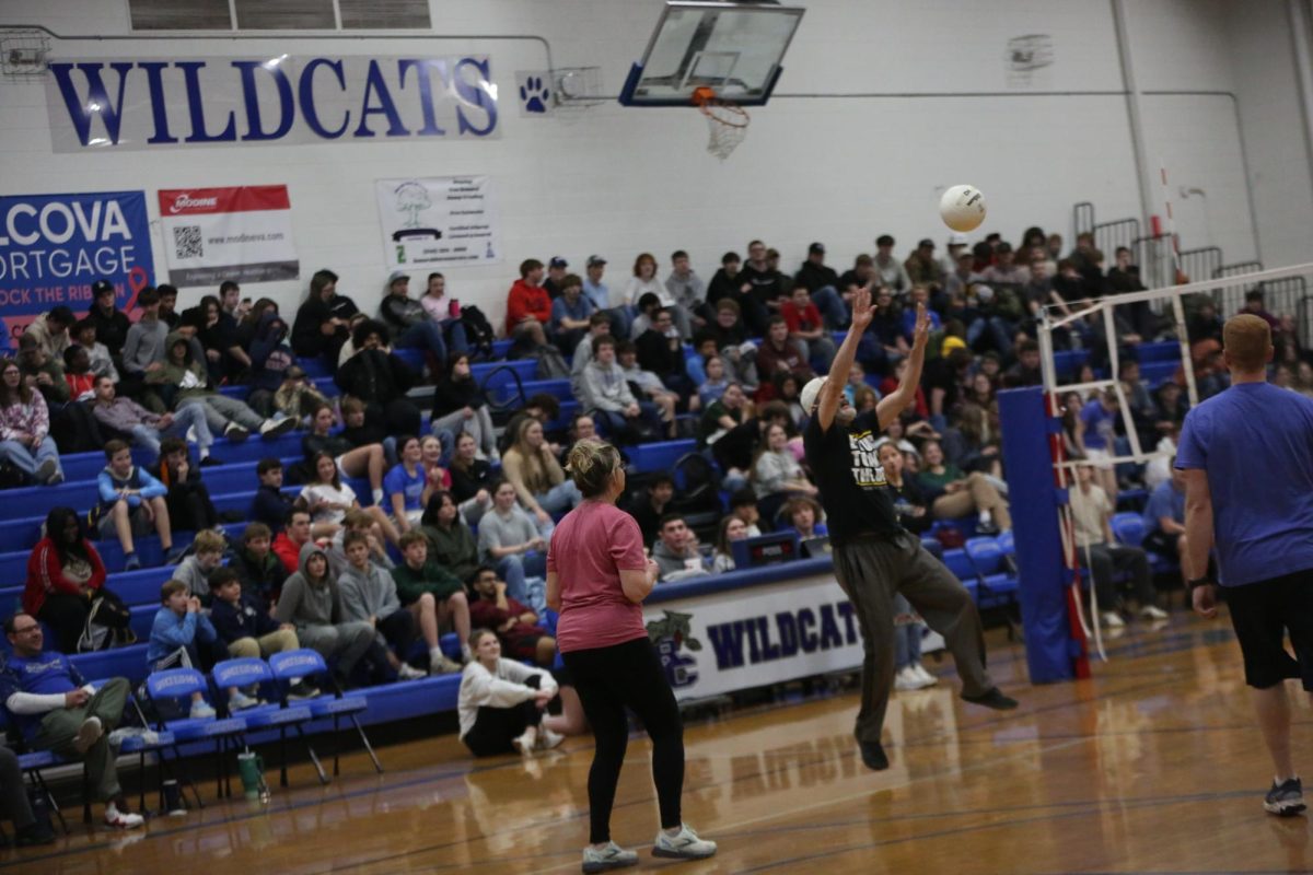 Spanish teacher Scott Youngdahl sets the ball.