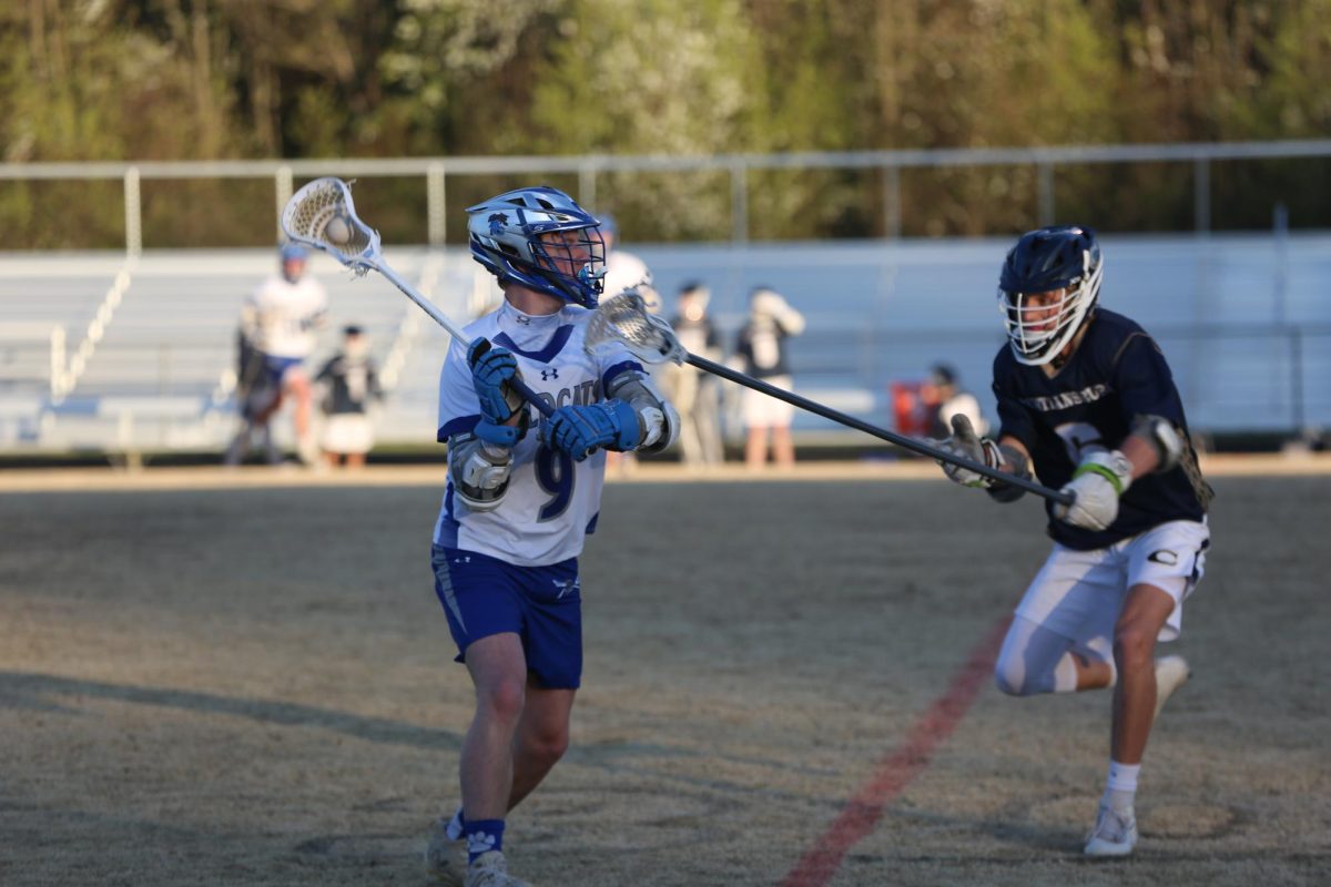 Junior Aiden Myers challenges a defender. 