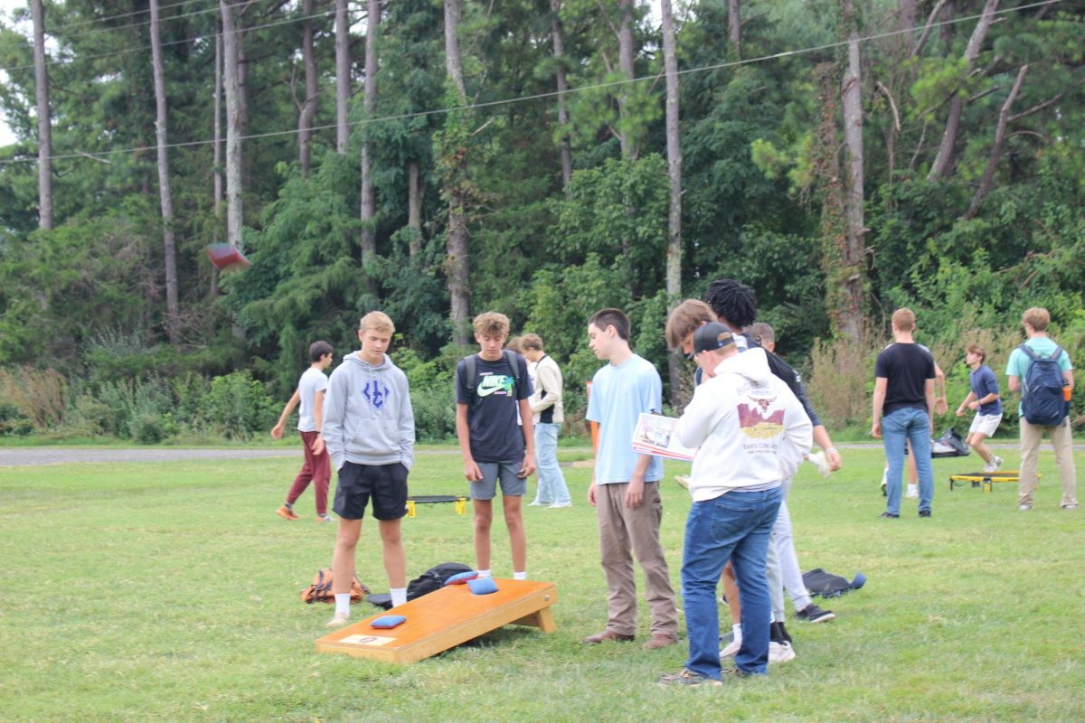 Students play cornhole.