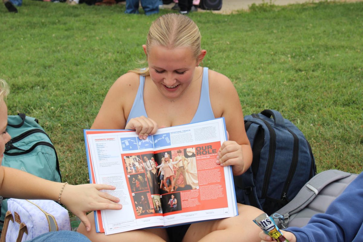 Sophomore Abigail Woodford looks at her photo.
