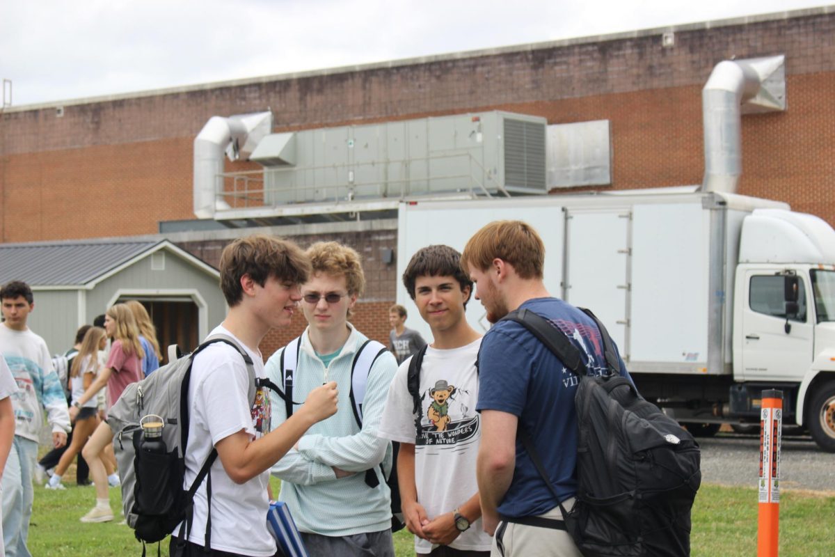Students talk with each other.