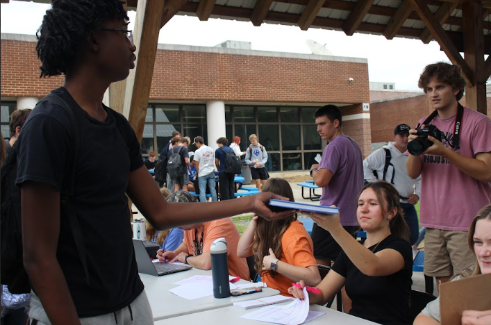 "Yearbook distribution day was so much fun. I've never been able to sit behind the table and cross off peoples names before, but It was nice to be able to see a lot of people, and give them their yearbooks. It seemed like everyone had fun, and i loved seeing everyone sharing their books and reminiscing on the past year" - Senior Presley Brzostek
