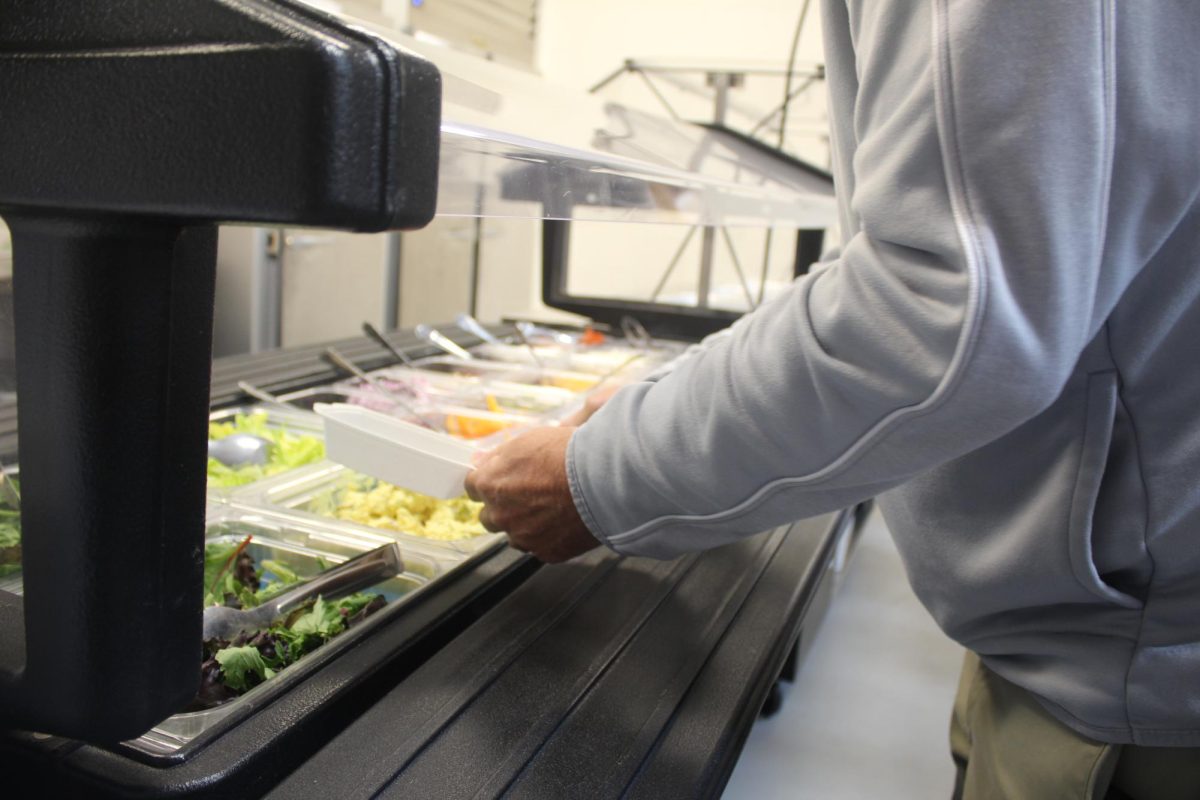 Teacher utilizes the free culinary lunch services.