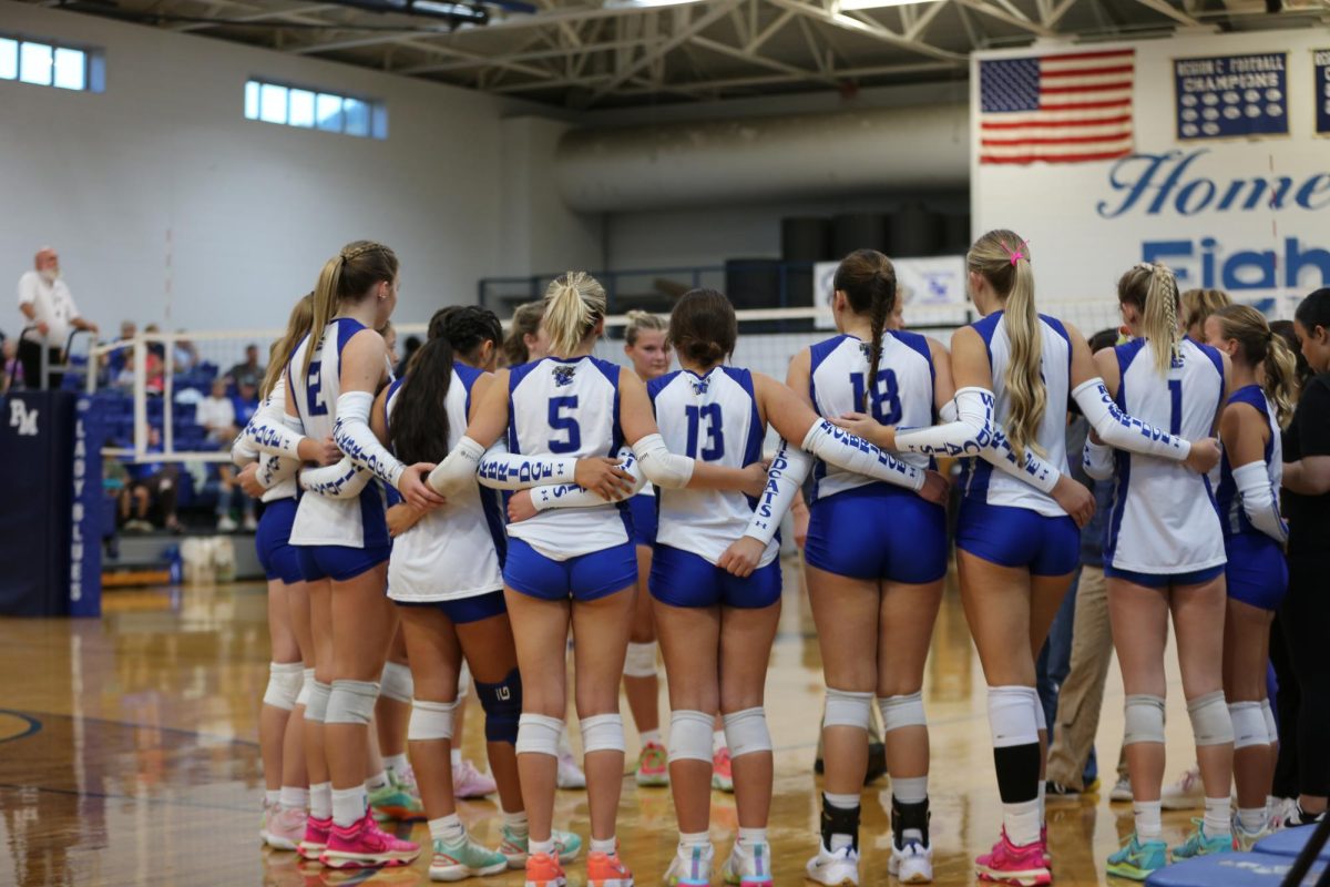 Team huddles talking about the game.