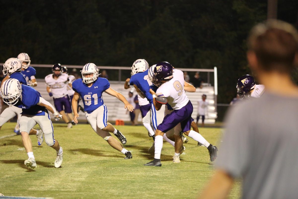 Sophomore Parker Zollman runs during a play.