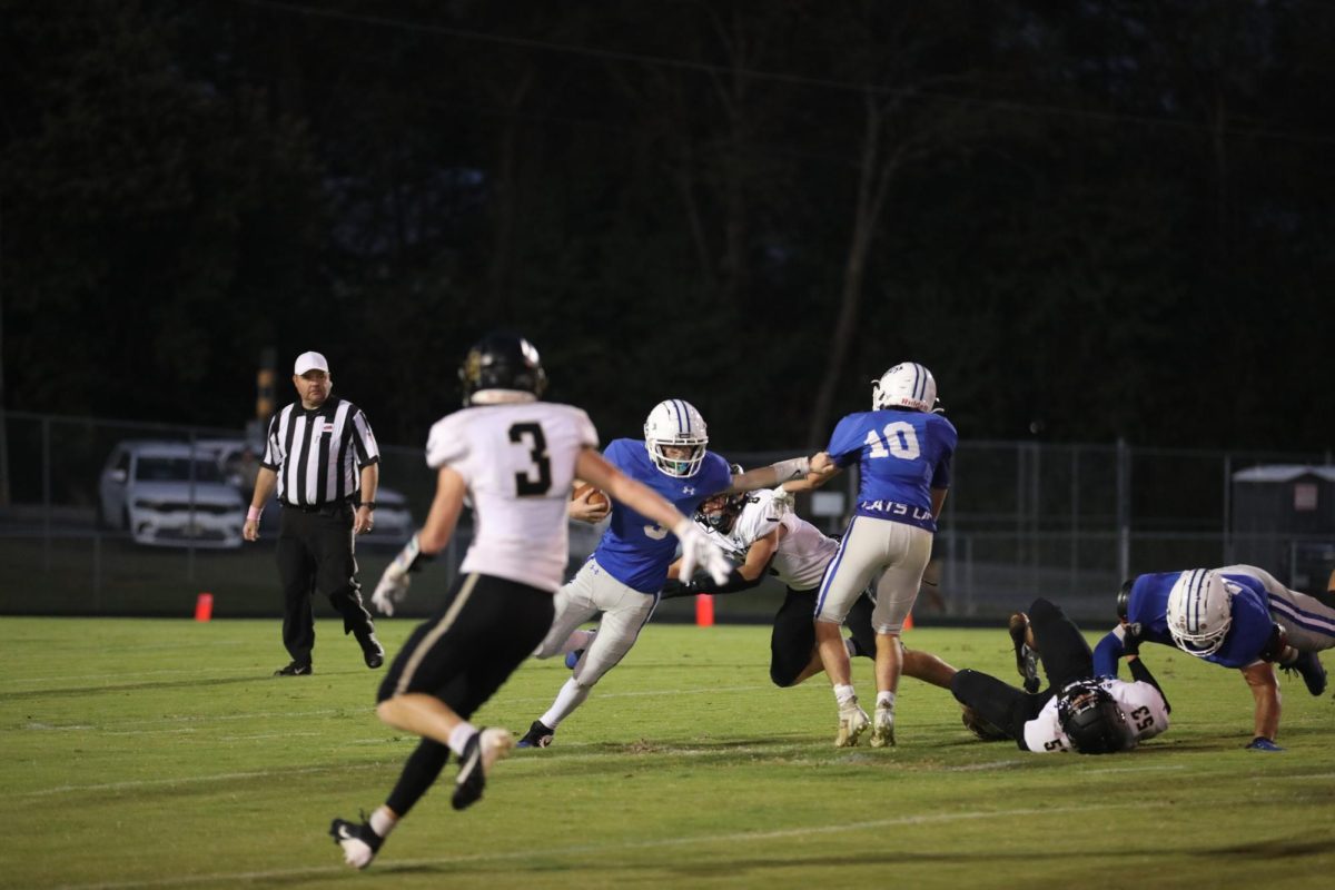 Freshman Taylan Tyree runs the ball.