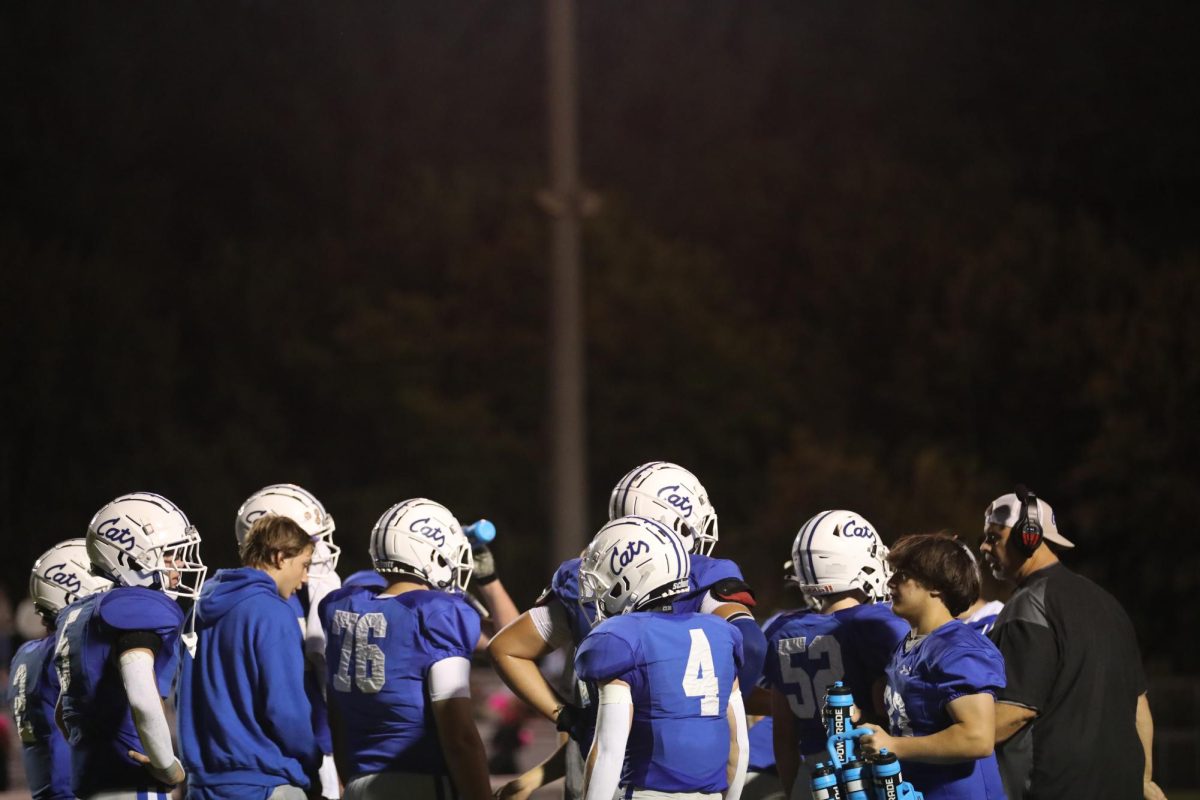 The team huddles during their timeout.