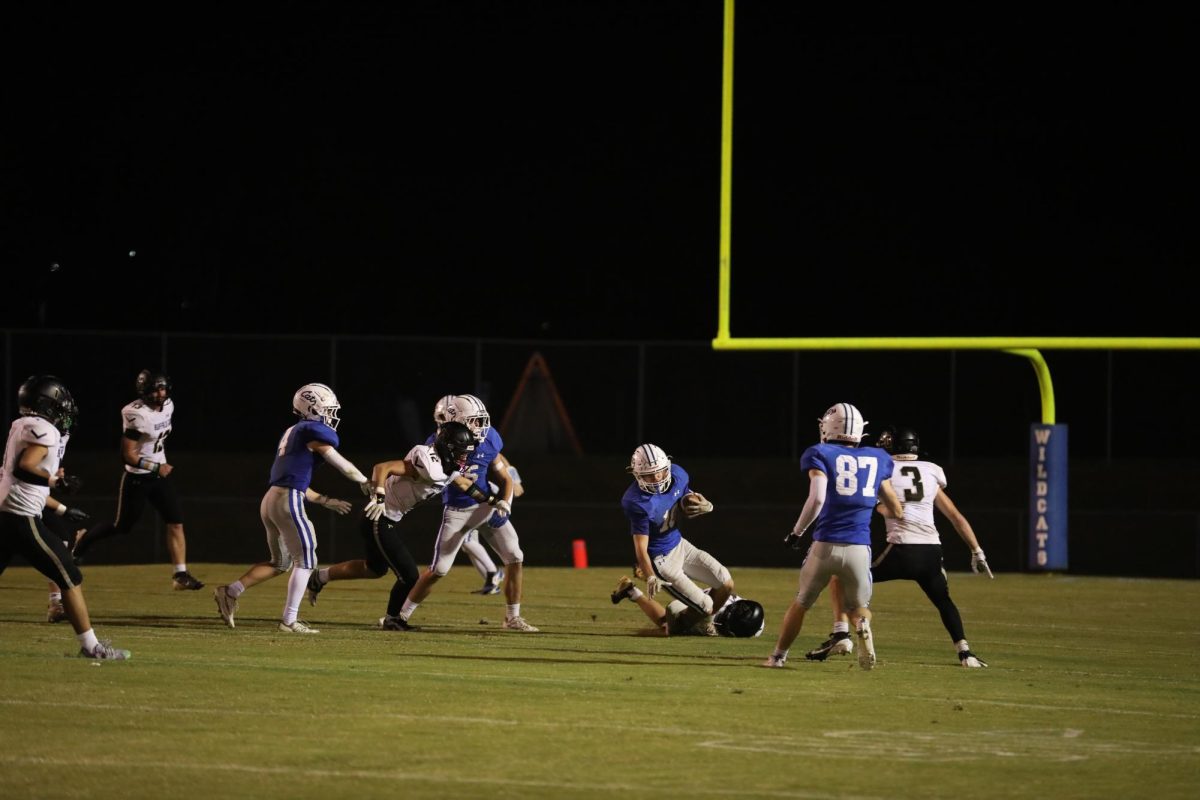 Senior Aiden Meyers runs the ball.