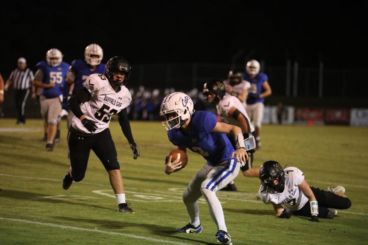 Freshman Taylan Tyree runs dodges his opponents. 