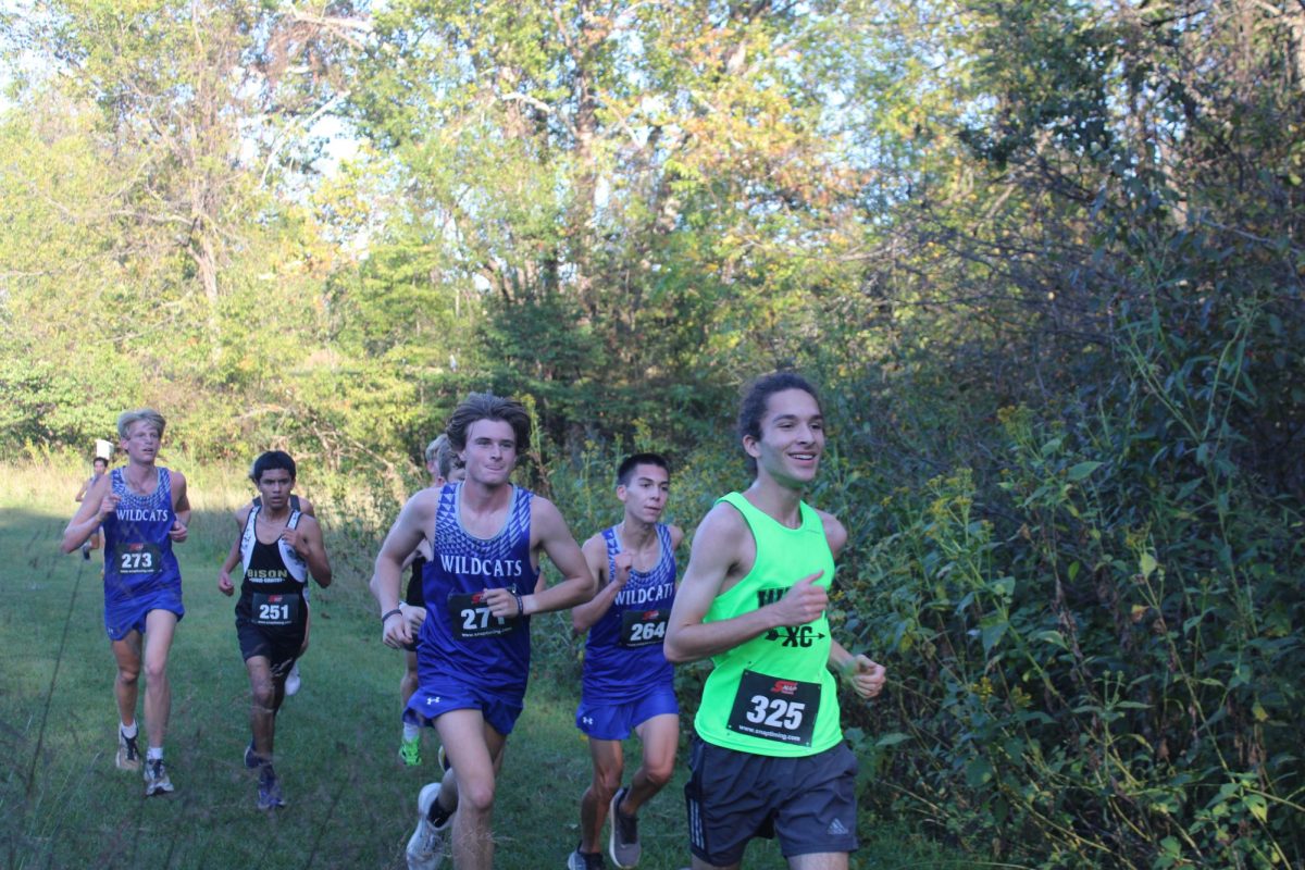 Junior Oscar McClung races other runners.
